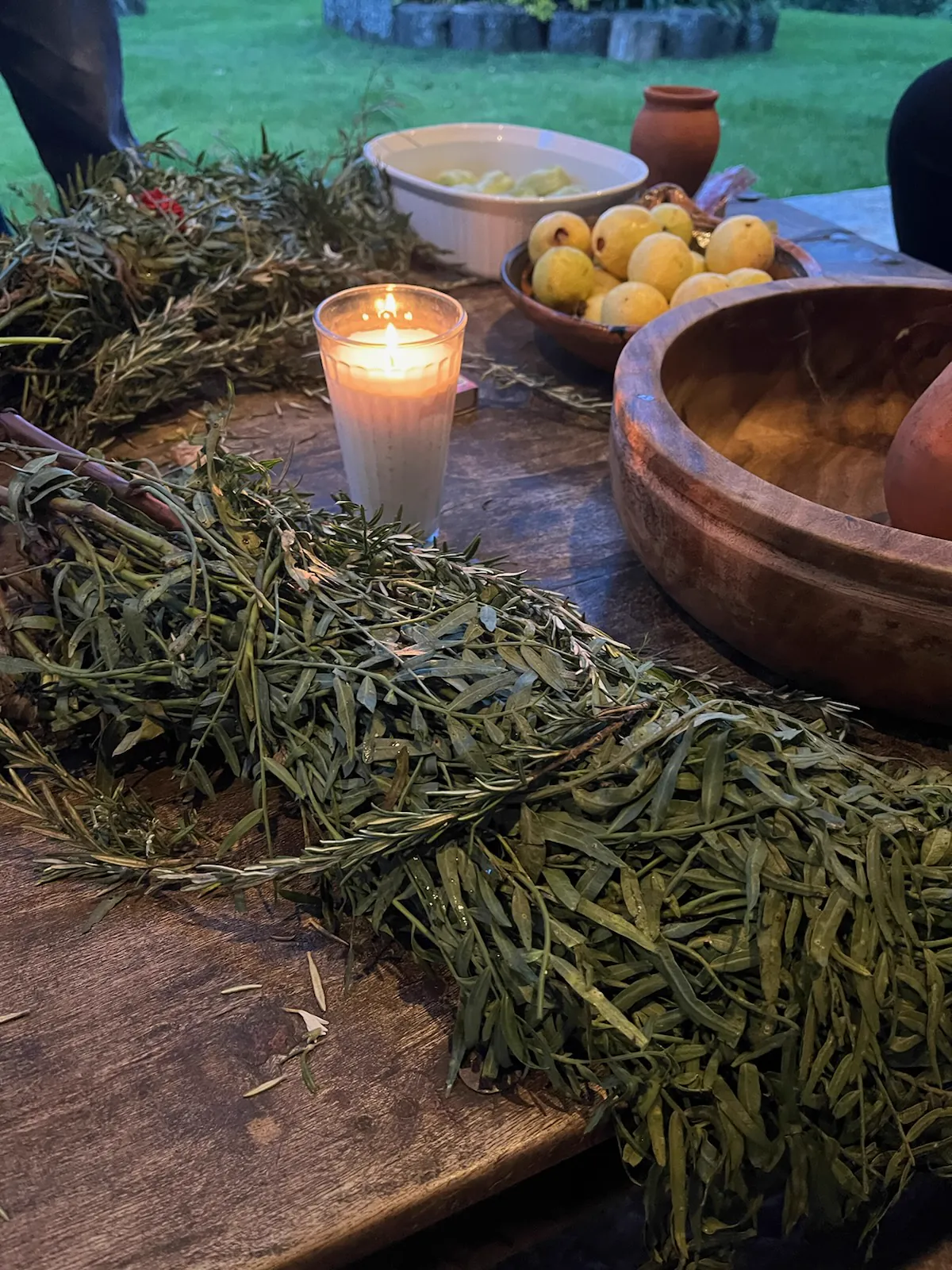 Herbs, fruit and a candle beside the garden during a visit to Mexico.
